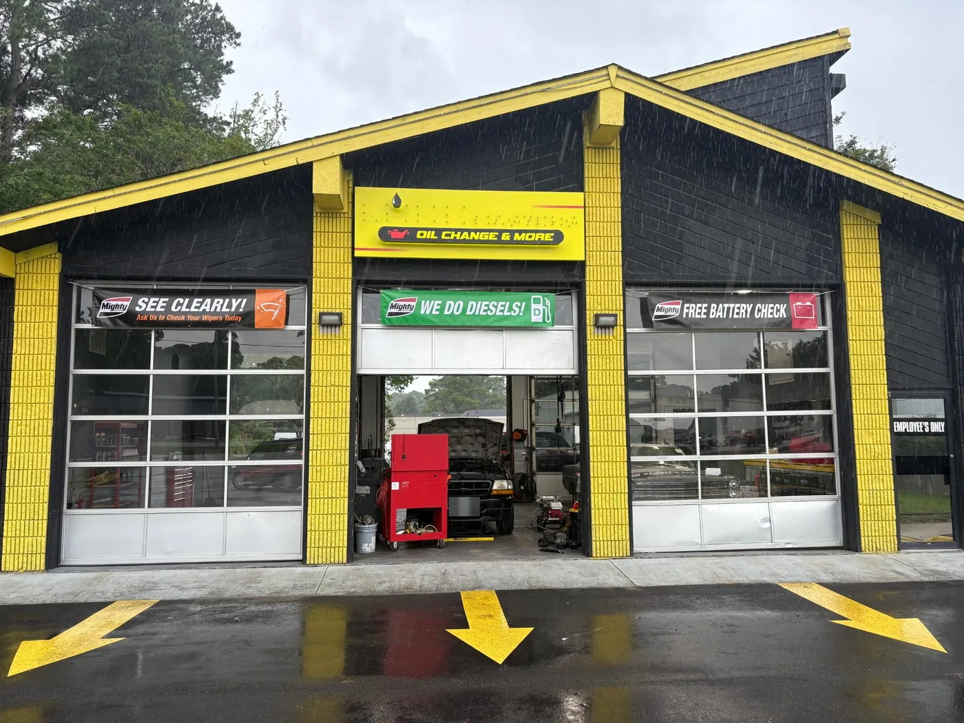 Non-Skid Oil Change and More garage bays with service banners